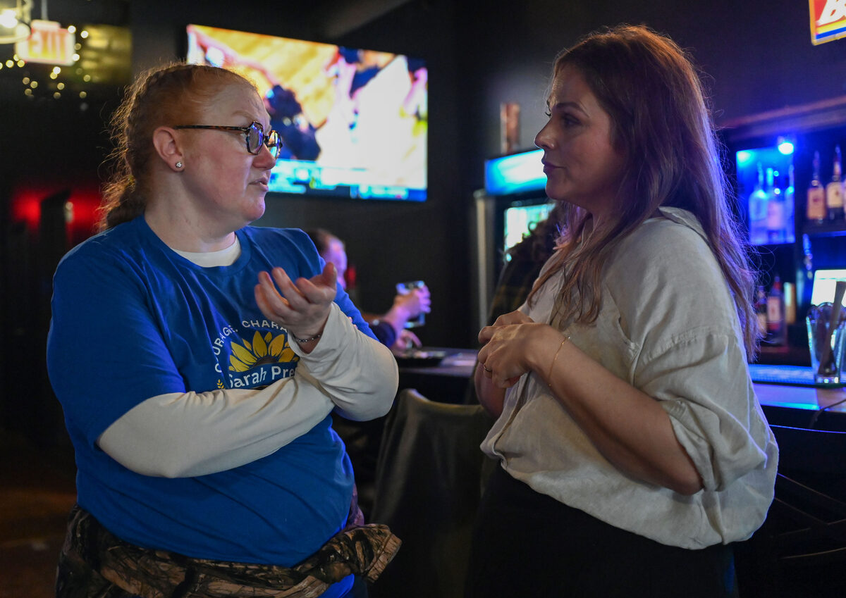 Sarah Preu talking with a campaign volunteer